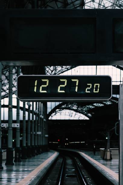 istock Digital clock above the railway in a train station 1446170830
