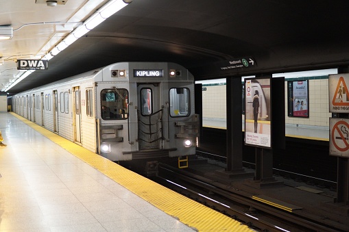 Toronto, Canada – May 13, 2020: A TTC line 2 subway train arriving at Christie Station in Toronto, Canada