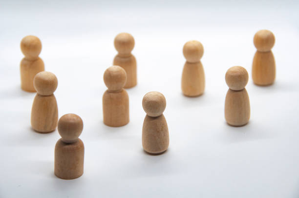 istock Wooden figure gather as a group on white background. Teamwork concept 1446173011
