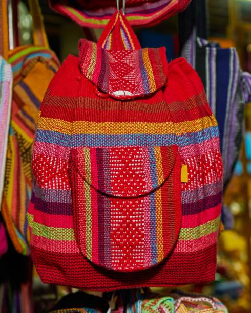 istock Beautiful shot of a handmade colorful woven backpack 1446174741