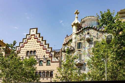 Barcelona, Spain – June 29, 2012: Casa Batllo and Casa Ametller facades ,at famous Passeig de Gracia avenue.They are famous touristic attractions in Barcelona. Spain.