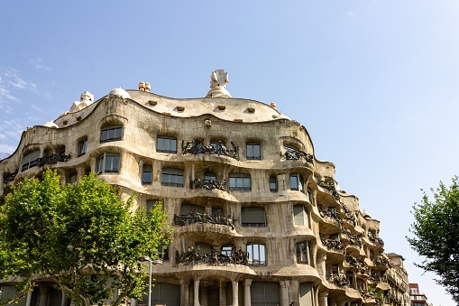 Barcelona, Spain – June 29, 2012: The facade of modernist house La Pedrera (Casa Mila) designed by Gaudi in Barcelona, Spain