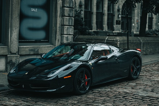 Montreal, Canada – June 17, 2022: A black Ferrari 458 Italia in the streets of old Montreal, Canada
