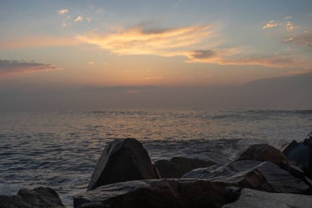 istock Beautiful seascape from the rocky shore at sunset. 1446179101