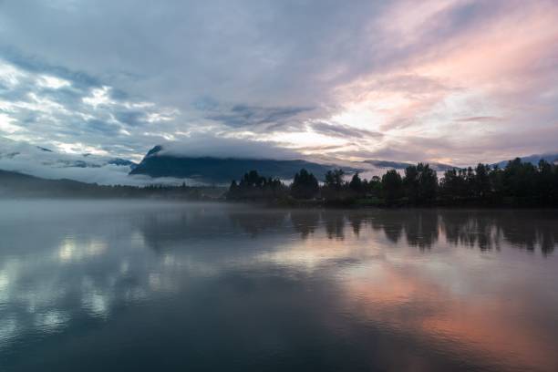 istock Aerial view of lake surrounded by trees during sunset 1446179412