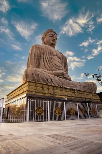 A vertical shot of the Great Buddha Statue in Bodh Gaya