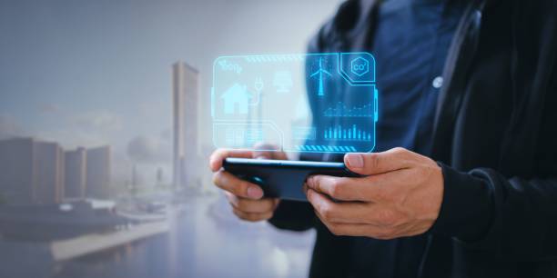 istock Man with a phone in his hand with electricity source icons above the screen 1446179949