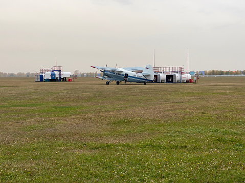 Novosibirsk, Siberia, Russia - September 25, 2022. Aircraft with open hatch waiting for parachutists at the airfield.