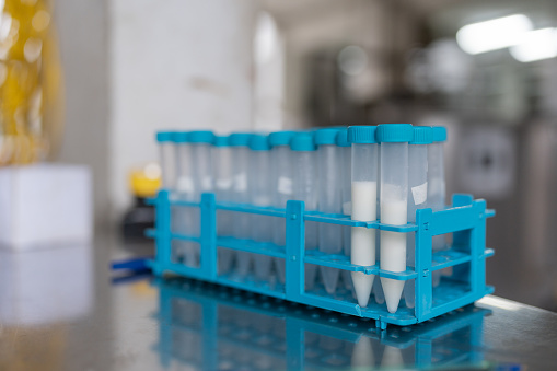 Selective focus and close up view of pipettes in a laboratory of a dairy processing industry