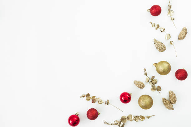 istock Christmas holidays composition with golden and red tree decoration on white background. Flat lay, top view. 1446184455