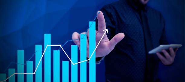 istock Man Standing Holding Tablet And Pressing On Virtual Graph. Business Man Carrying Pad Tapping Switch 1446184526