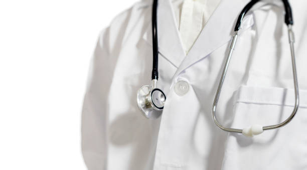 istock A half-standing doctor, without a face, holding a stethoscope against a white background.stand straight 1446184532