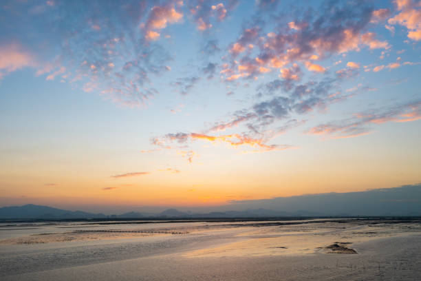Romantic clouds in seaside sky after sunset