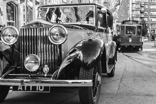 Hamburg, Germany - November 15.2020: look through the side window onto the steering wheel and dashboard in a Mercedes Benz classic car oldtimer, parked somewhere in Hamburg, downtown. Black and white image