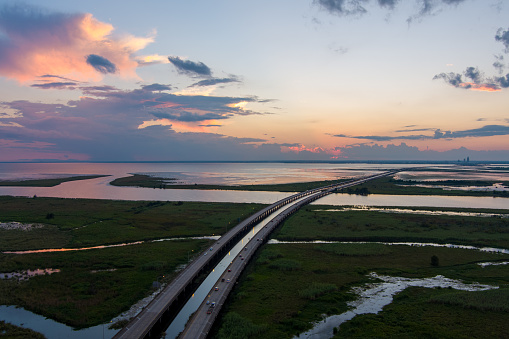 Aerial view of Jubilee Parkway bridge on Mobile Bay at sunset in Daphne, Alabama