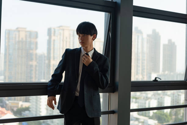 istock business man enjoying the scenery by the window 1446186633