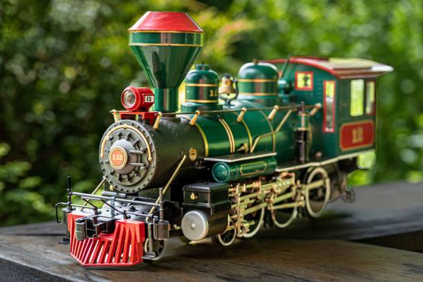 istock Green toy train on a wooden table 1446187458