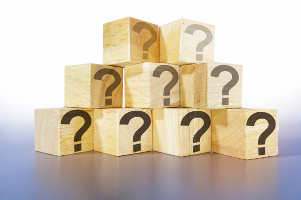 istock question icon on wooden box light gray background,Abstract image of doubt and ignorance 1446191094