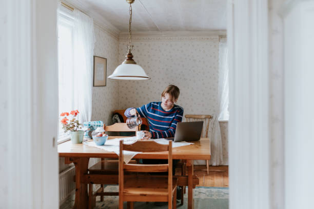 Young woman making morning coffee