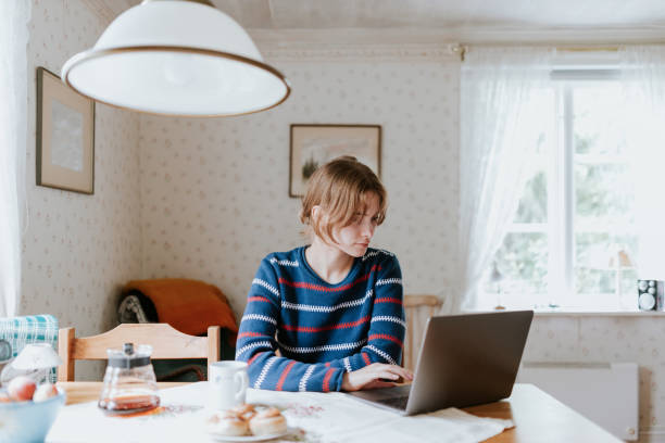 istock Young woman working from her summer cottage 1446195035