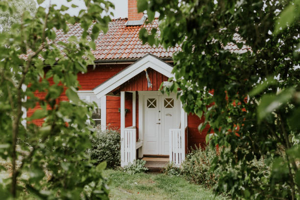 Red traditional nordic summer cottage stock photo