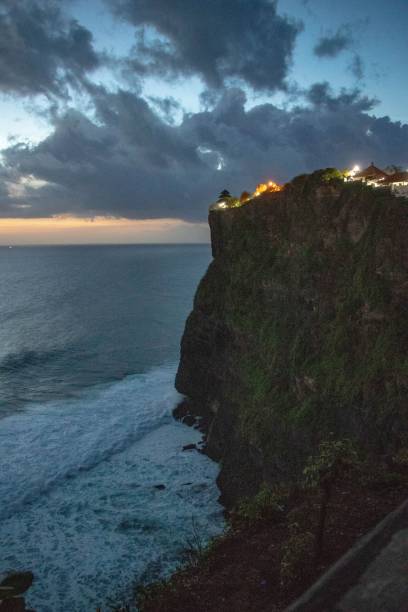 istock Vertical shot of a high cliff on the seashore during sunset 1446195398