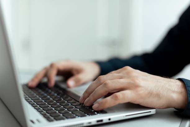 istock Businessman Typing Recent Updates On Lap Top Keyboard On Desk. Executive Inserting  Data Into Pc. 1446195541