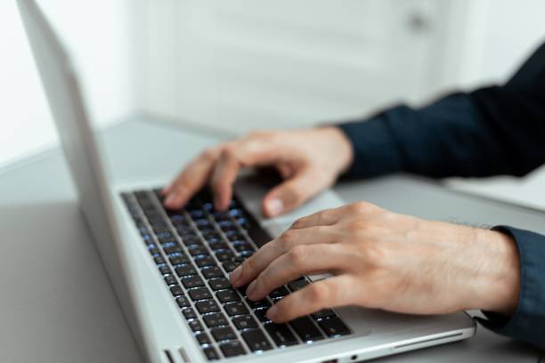 istock Businessman Typing Recent Updates On Lap Top Keyboard On Desk. Executive Inserting  Data Into Pc. 1446195560
