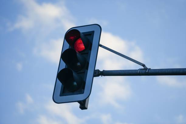 istock Low angle shot of a traffic light sign showing red 1446195949