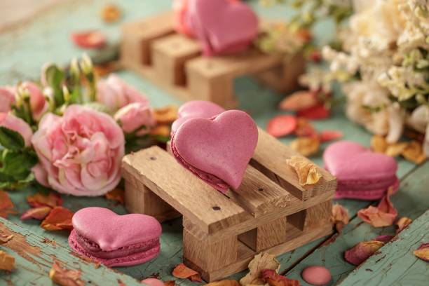 istock Heart shaped macarons on a wooden backgroun 1446197947