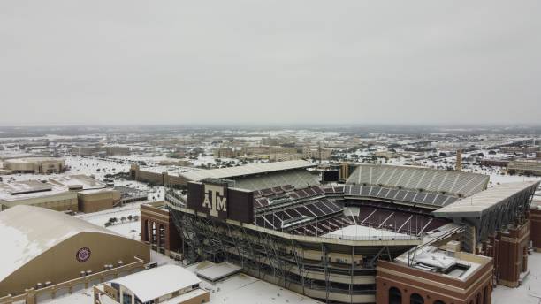 Aerial view of the Kyle Football Field covered in snow in College Station, Texas, USA College Station, United States – December 19, 2020: An aerial view of the Kyle Football Field covered in snow in College Station, Texas, USA kyle field stadium stock pictures, royalty-free photos & images