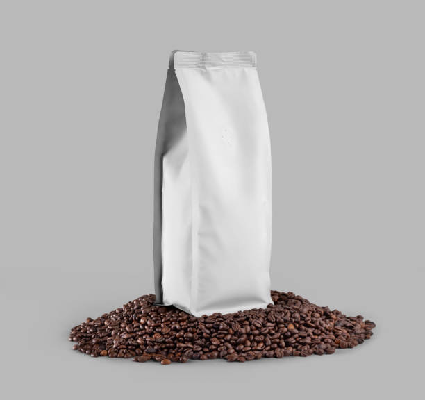 istock White coffee pouch mockup, closeup, bag presentation on coffee beans, front, side view, isolated on background. 1446198444