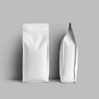 Mockup of a white bag for coffee beans, packaging with a degassing valve, front, side space for design, branding. Set. Template of stable pack with tea, for advertising, isolated on background