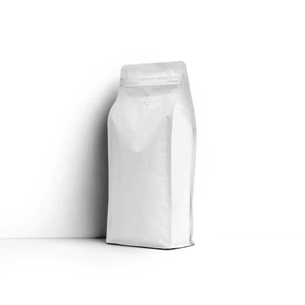 istock Mockup of a white stable bag for coffee beans, packaging with a degassing valve, front, side space for design, branding. 1446198603