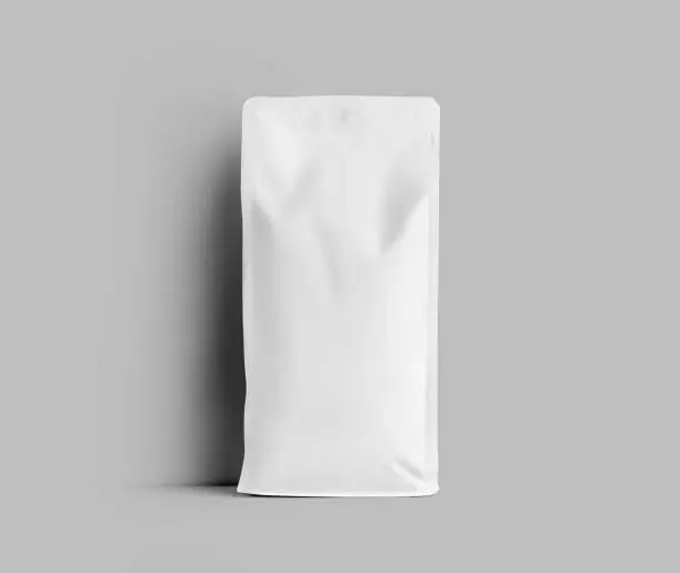 Mockup of white gusset packaging for coffee beans, coffee pouch, isolated on wall background. Doypack template for loose tea, for presentation, design, pattern