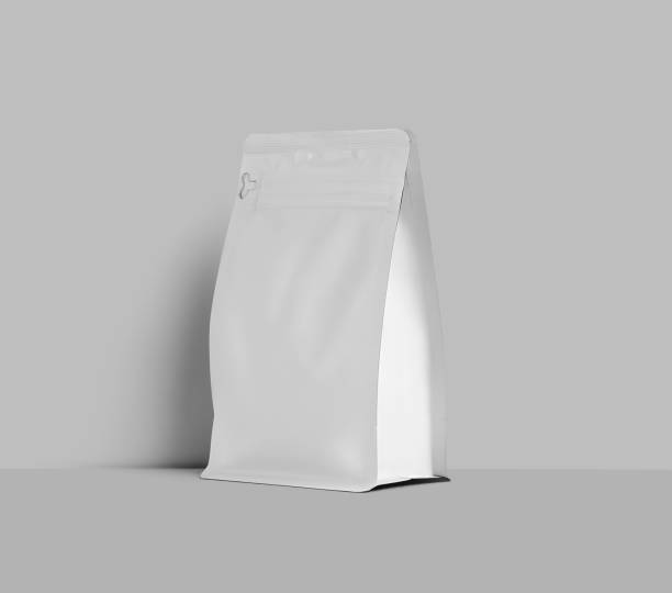 istock White doy pack template for coffee beans, stable packaging stands near the wall, isolated on background. 1446198729