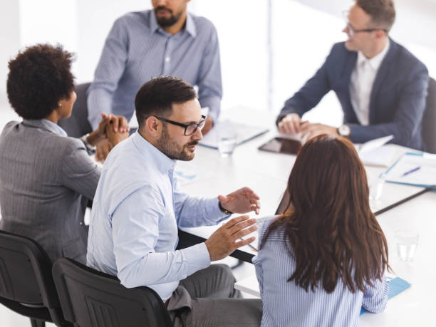 istock Business colleagues talking on a meeting in board room. 1446200996