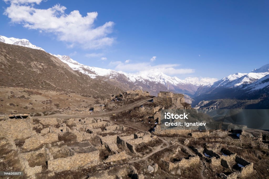 Ancient city remains in mountains from the aerial view in a bright sunlight. Typical Beautiful village in Nepal Splendid aerial view on an remains of an ancient city in mountains from the aerial view in a bright sunlight for a historical topics Adventure Stock Photo