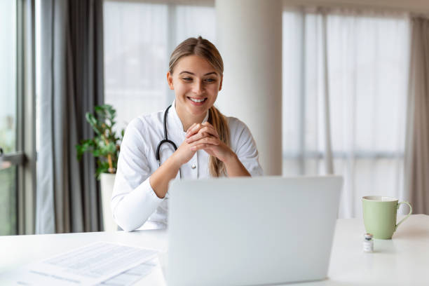 istock Female doctor having online therapy with her patient's, giving them advice while using telemedicine as a new normal during COVID-19 pandemic outbreak 1446204054
