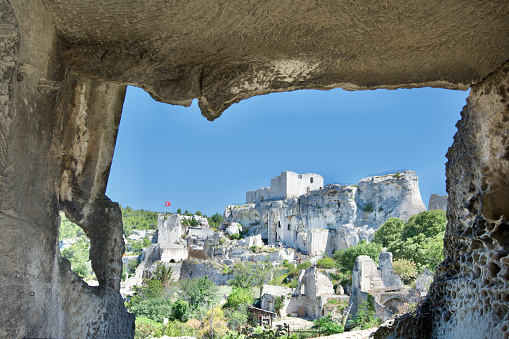 Very famous Les Baux de Provence Castle seen from a cave.