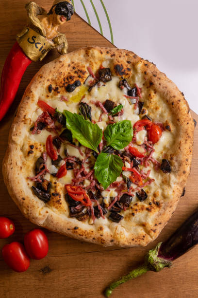 istock Neapolitan pizza on the table from above in the restaurant 1446213349