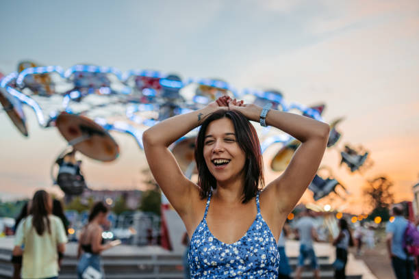 Beautiful young woman enjoying her time in an Amusement park.