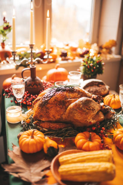 istock Thanksgiving holiday dinner table setting with fall decoration and pumpkins 1446214167