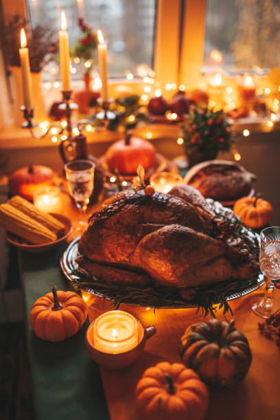 istock Thanksgiving holiday dinner table setting with fall decoration and pumpkins 1446214180