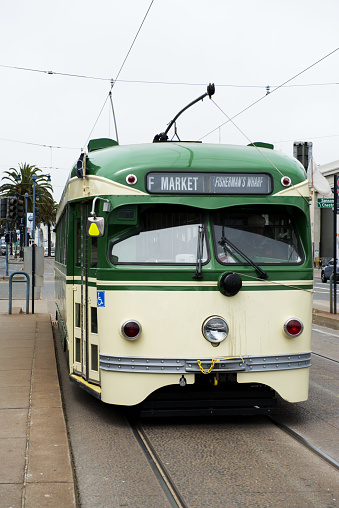 Lisbon, Portugal - August 13, 2022: A traditional old tram runs along a street in Lisbon downtown.