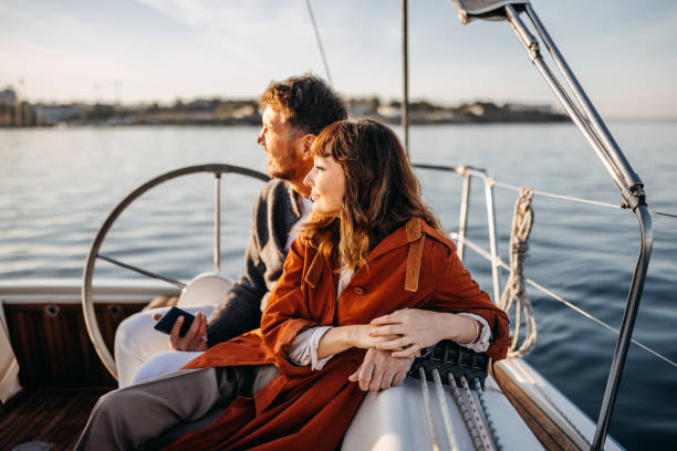 I love you the most Couple enjoying their vacation on the yacht together sailing couple stock pictures, royalty-free photos & images