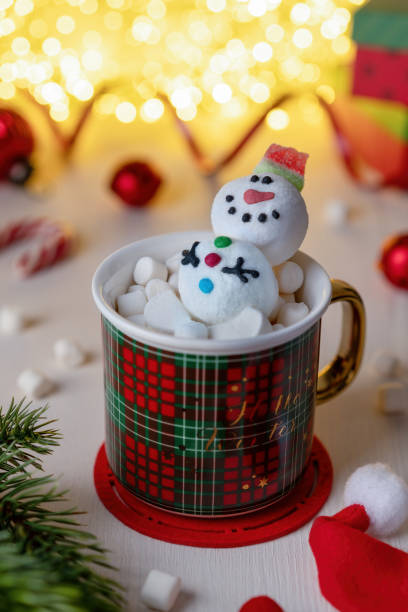 istock Christmas Red mug with marshmallow snowman. 1446218447