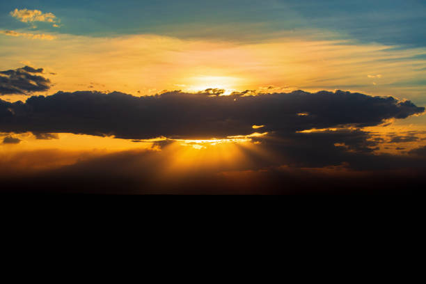 istock Beautiful sunset with sunbeams in the sky 1446219890