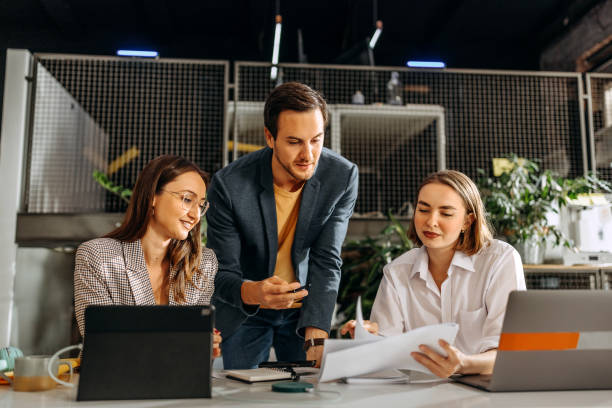Let's brainstorm this Colleagues working together in the office accounting processes Accounting stock pictures, royalty-free photos & images