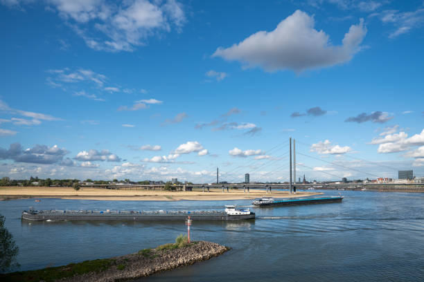 Düsseldorf, Germany - September 8, 2022: Inland navigation vessels passing Dusseldorf on the Rhine river on September 8, 2022 in Germany, Europe